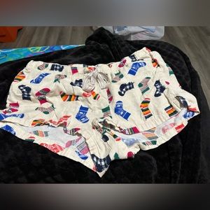 2 pairs of pj shorts. both XL, ones christmas theme, other is green and blue